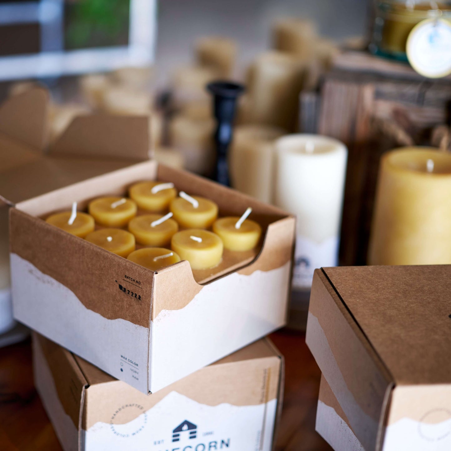 Box of beeswax candles with a blurred background