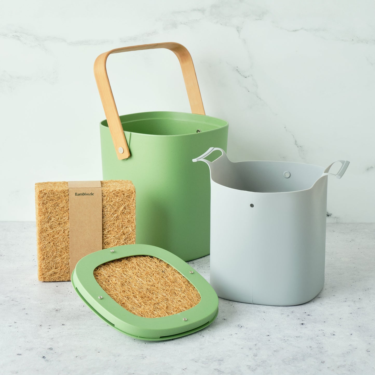 Astrik Compost Starter Bundle in avocado color on a light gray surface.