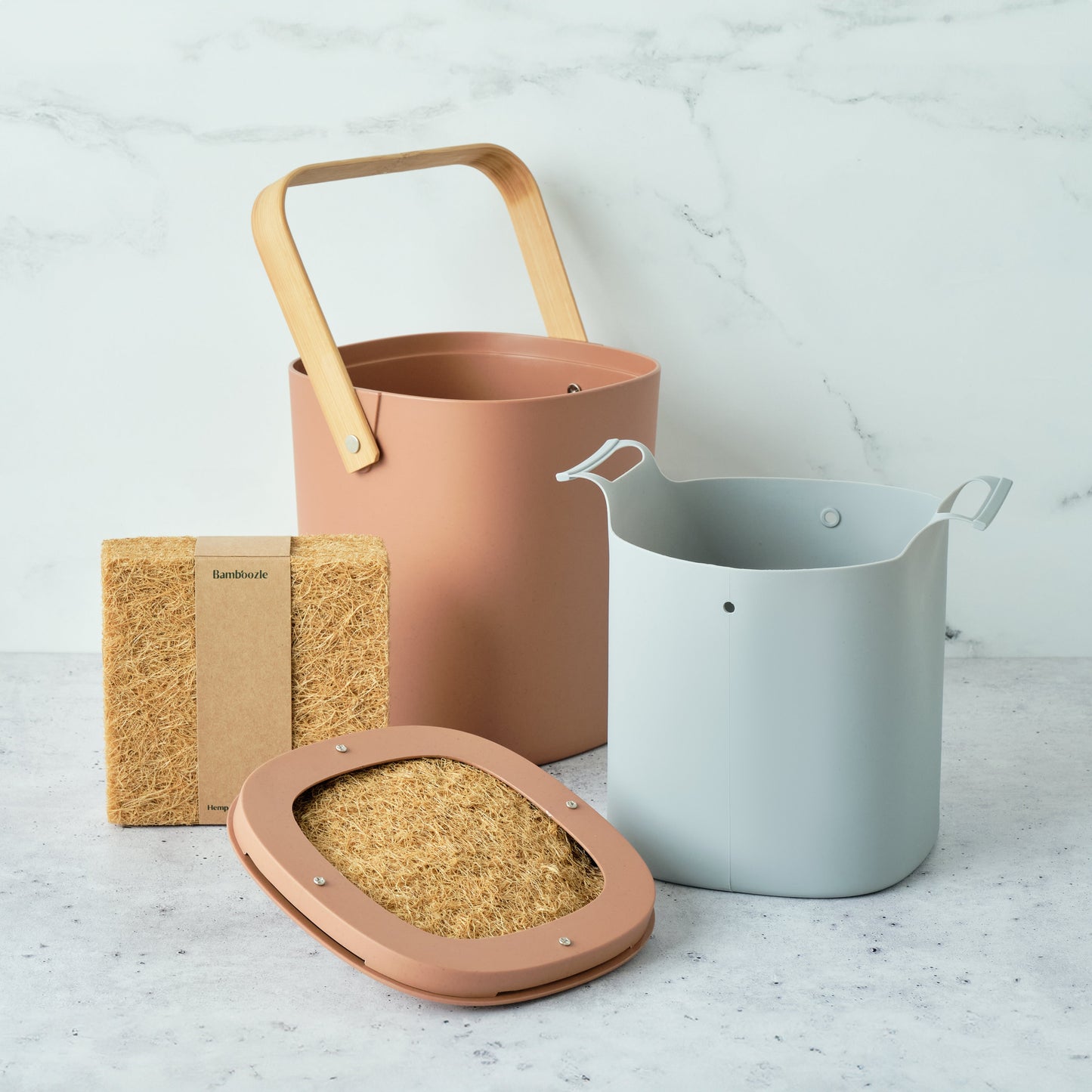 Astrik Compost Starter Bundle in terracotta on a light surface.