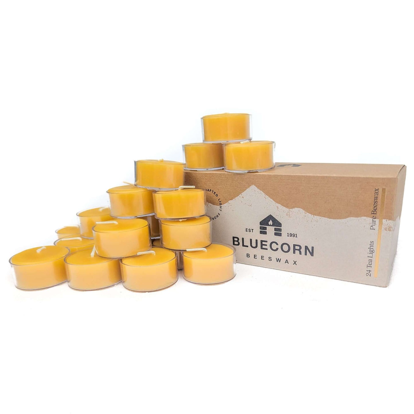 Box of 24 Bluecorn Beeswax candles with multiple candles stacked on top