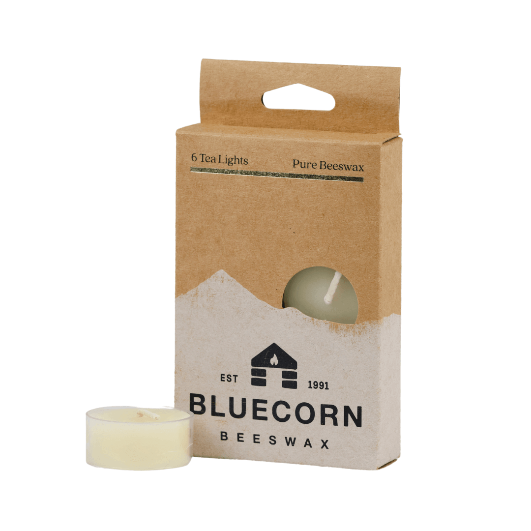 Bluecorn Beeswax tea light packaging with a candle on a white background