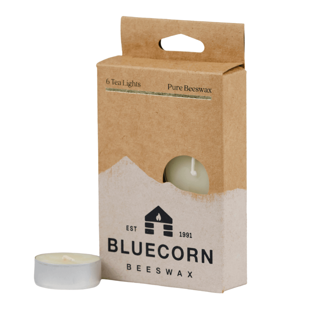 Bluecorn Beeswax packaging with a candle on a white background