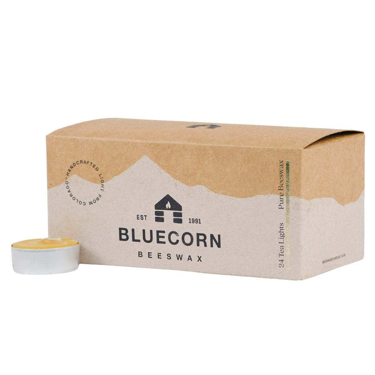 Box of Bluecorn Beeswax tea lights with a single tea light beside it on a white background