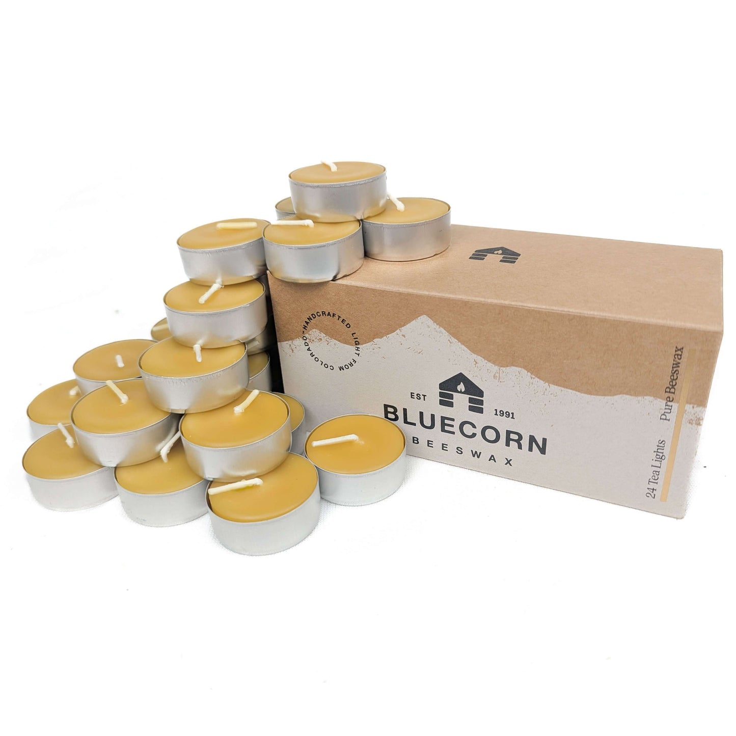 24 tea lights with a cardboard box labeled 'Bluecorn Beeswax' on a white background