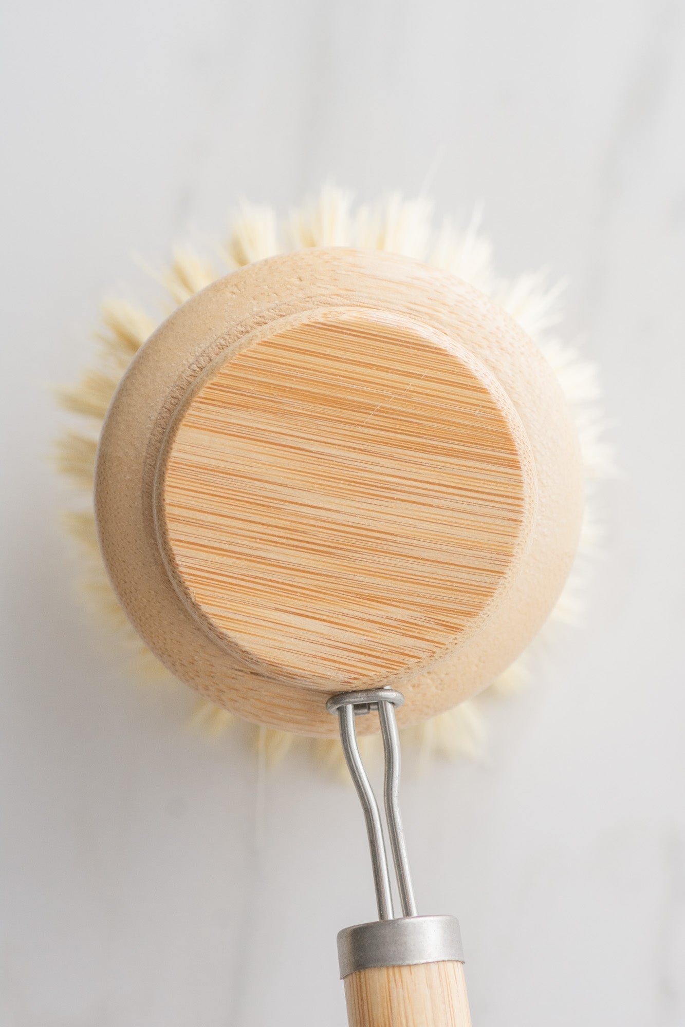 Bamboo scrubber brush with vegan bristles on a white background