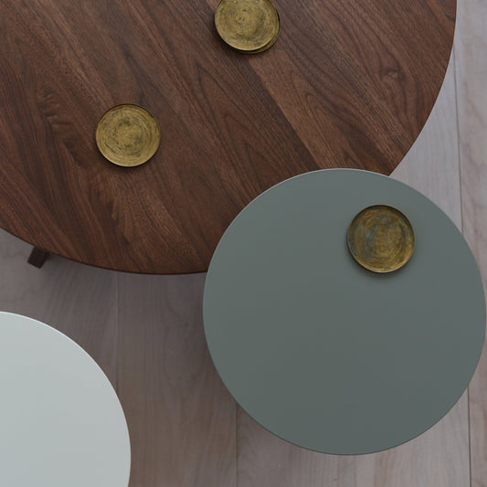 Conrad Cofee Table Solid Walnut with gold coasters on a wooden floor