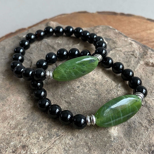 Jade Focal Bracelet. This bracelet is made with high-quality Jade and either Black Onyx or Obsidian stones which bring calm and insight to the wearer. Zodiac Signs: Capricorn, Gemini, Libra, Taurus, and Virgo. Chakra: Heart. Handmade with authentic crystal