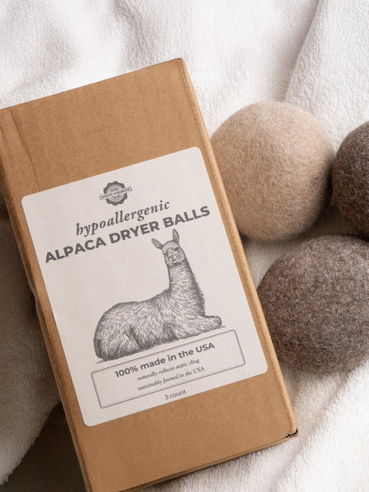 Rustic Strength Alpaca dryer balls with packaging on a white background