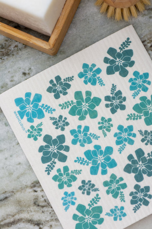 Dishcloth with blue floral patterns on a marble surface