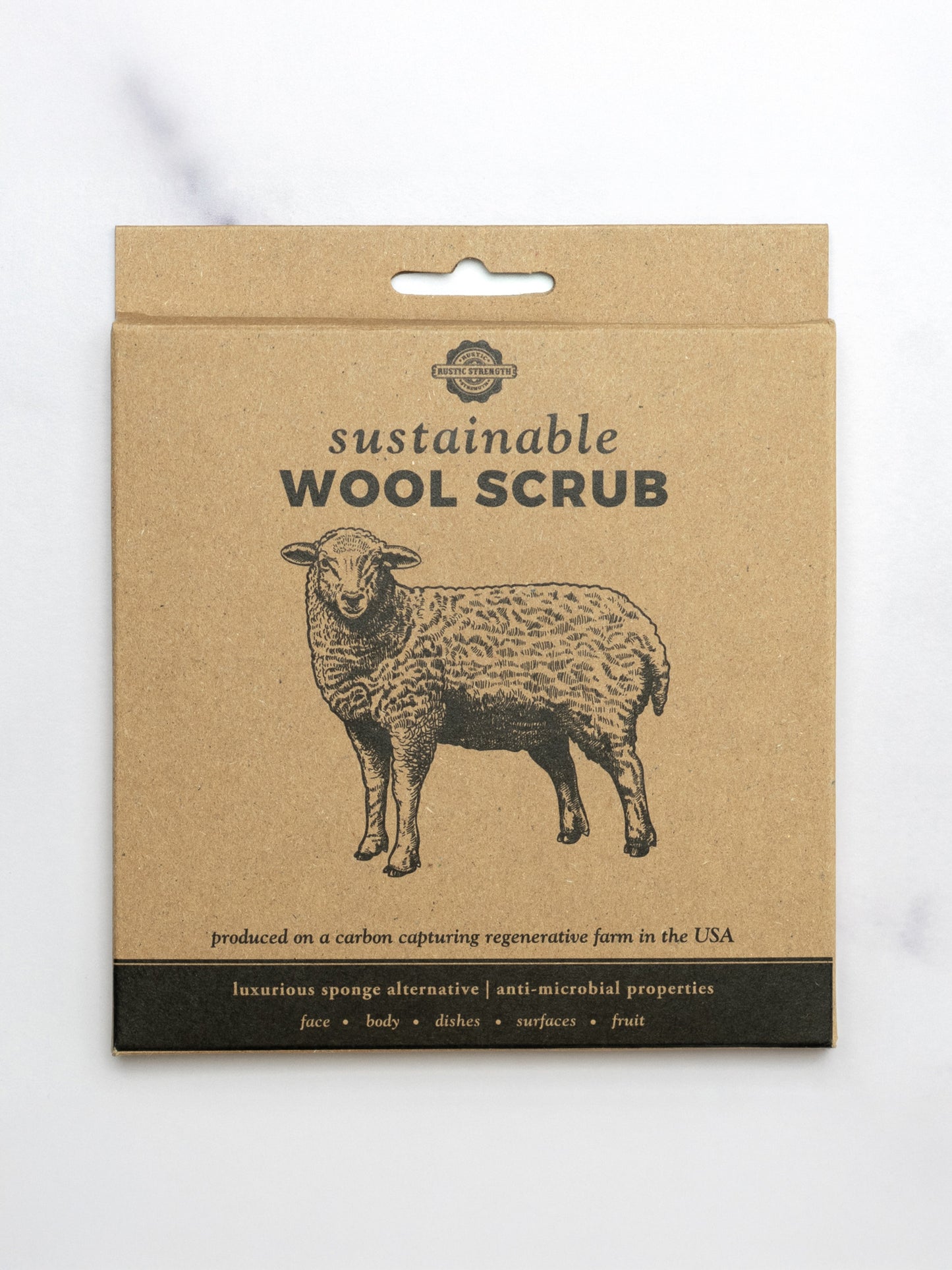 Packaging of sustainable wool scrub with a sheep illustration on a white background