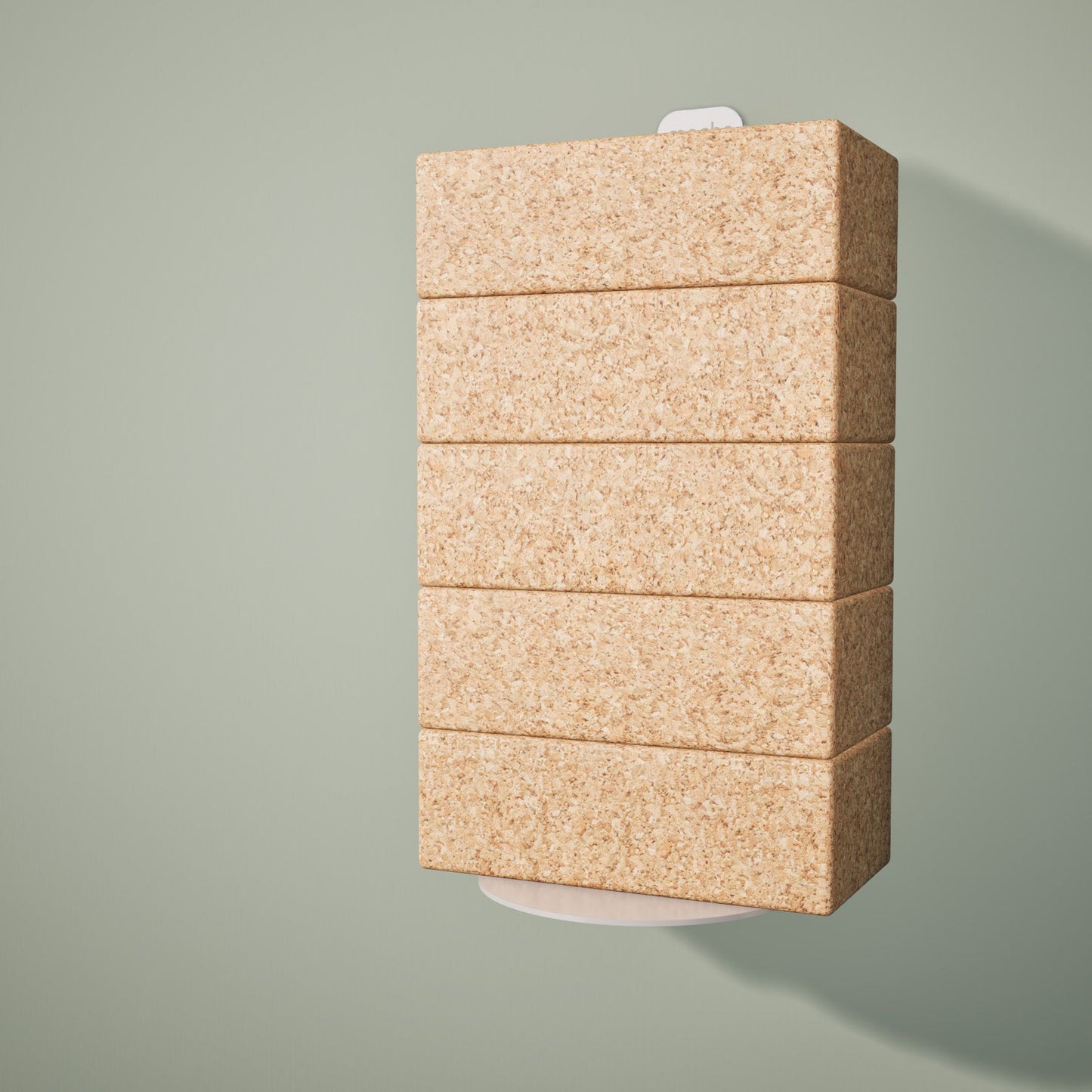Five cork yoga blocks resting on a wall-mounted yoga block shelf on a light green background