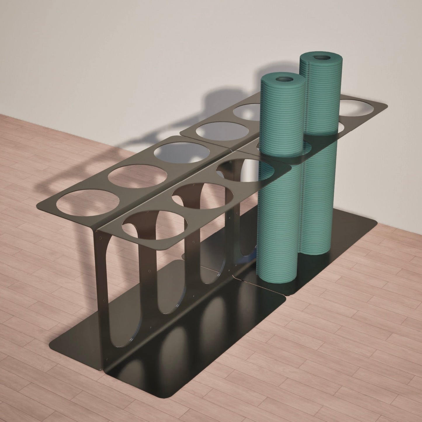 Two black Yoke yoga mat stands holding two of twelve yoga mats on a wooden surface.