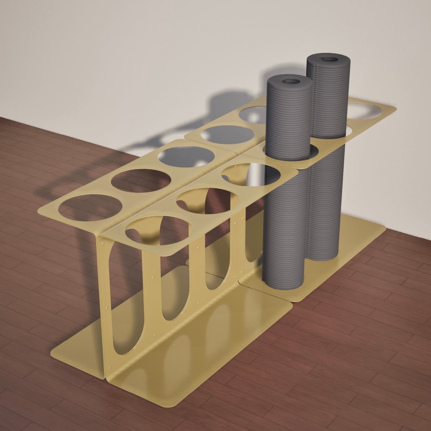 Two yellow Yoke yoga mat stands with two of twelve available slots used on a wooden floor