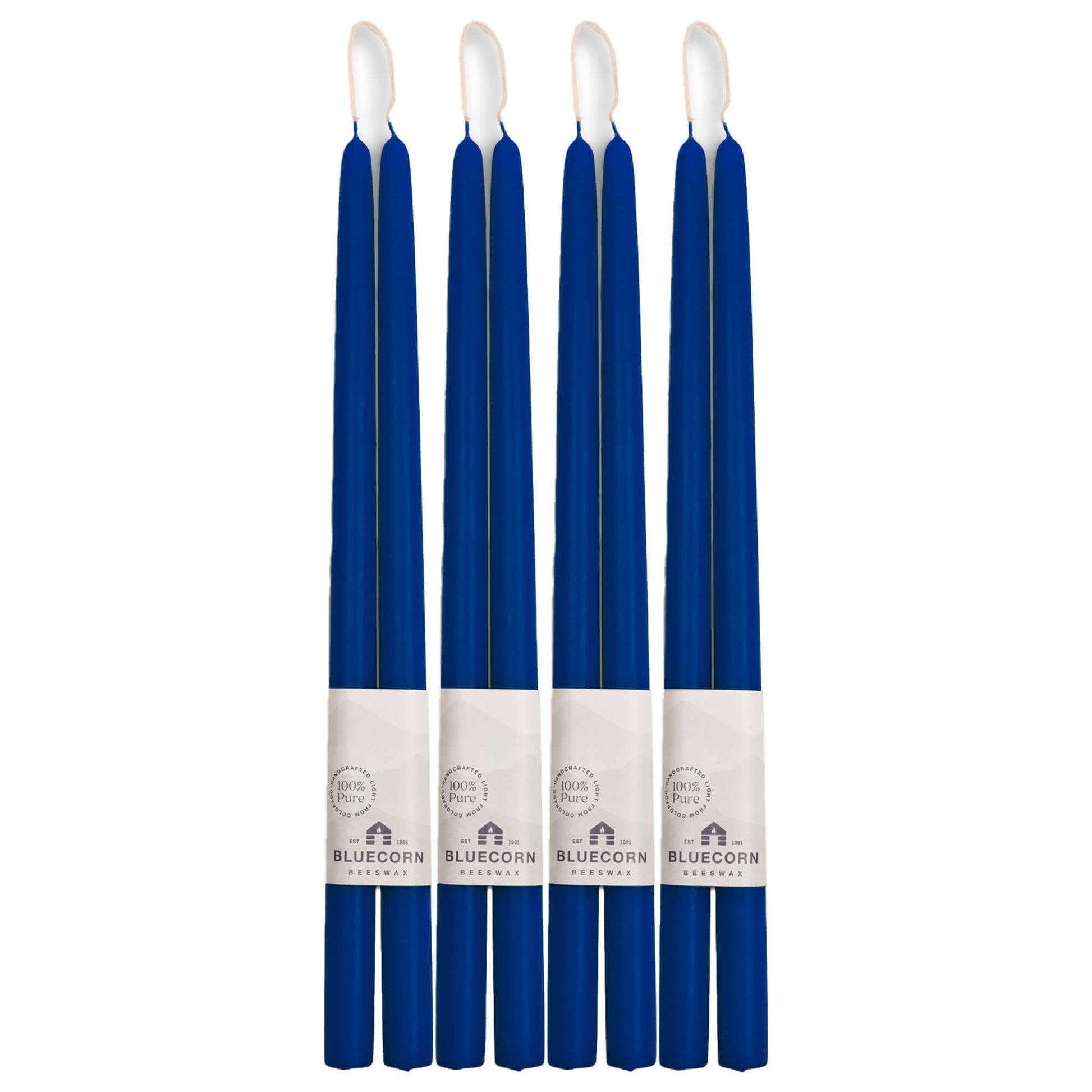 Set of eight blue candles with white wicks on a white background