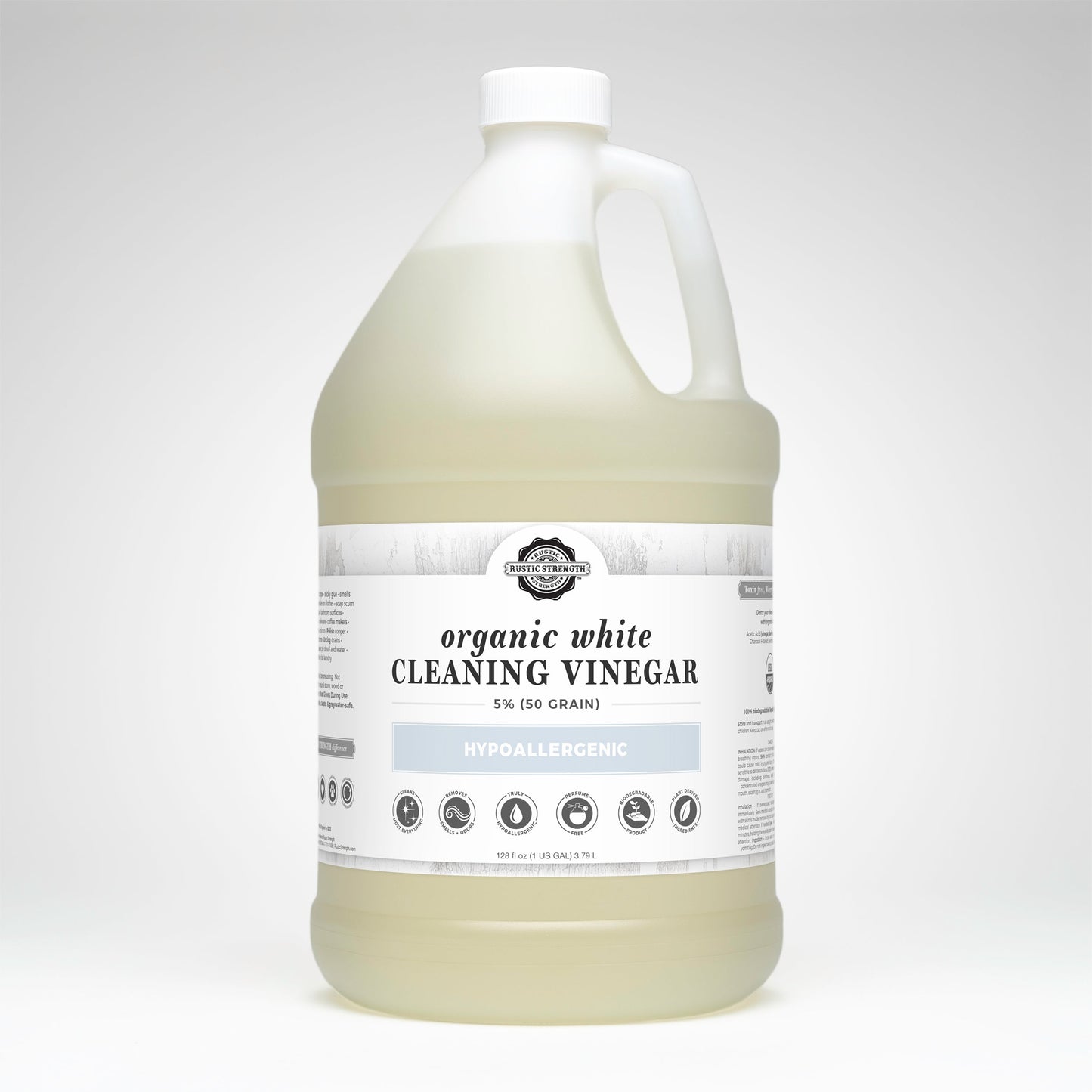 Gallon bottle of organic white cleaning vinegar on a white background