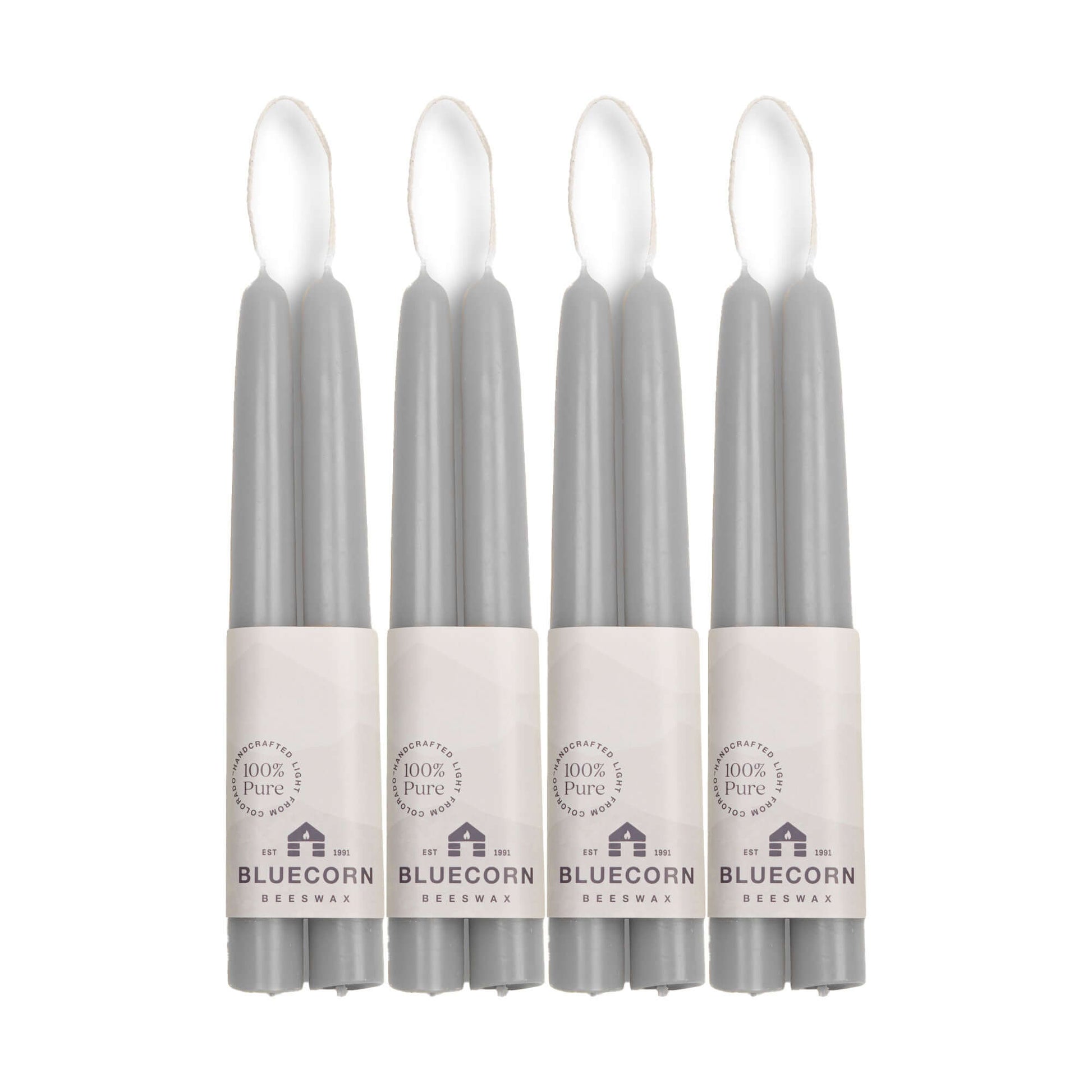 Eight gray candles in packaging with 'Bluecorn' branding on a white background