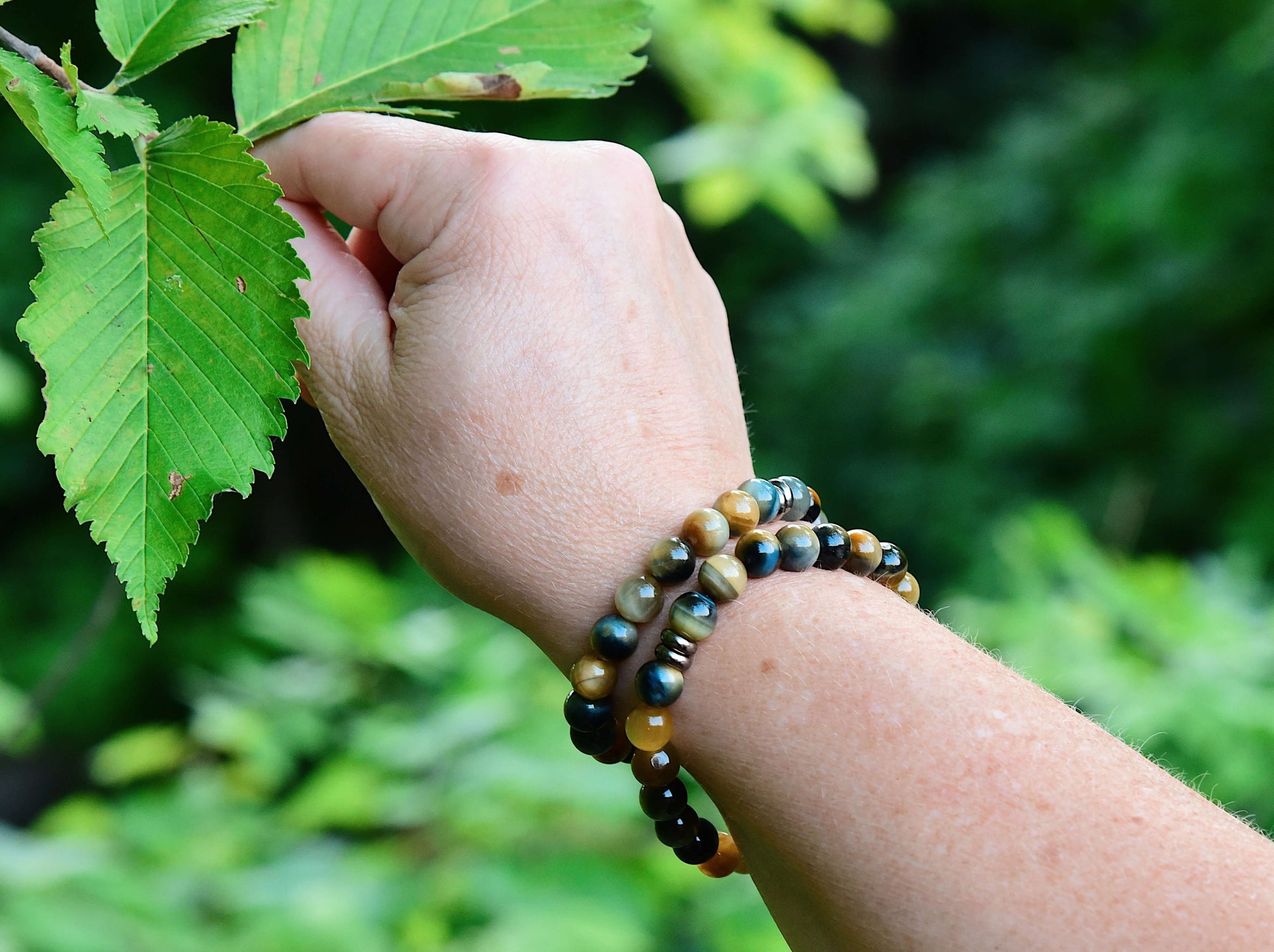 Blue and Blonde Tiger Eye Bead Bracelet This bracelet is made with high-quality Blue and Blonde Tiger Eye stones which bring confidence and optimism to the wearer. Zodiac Signs: Leo and Capricorn. Chakras: Root and Solar Plexus. Handmade with authentic cr