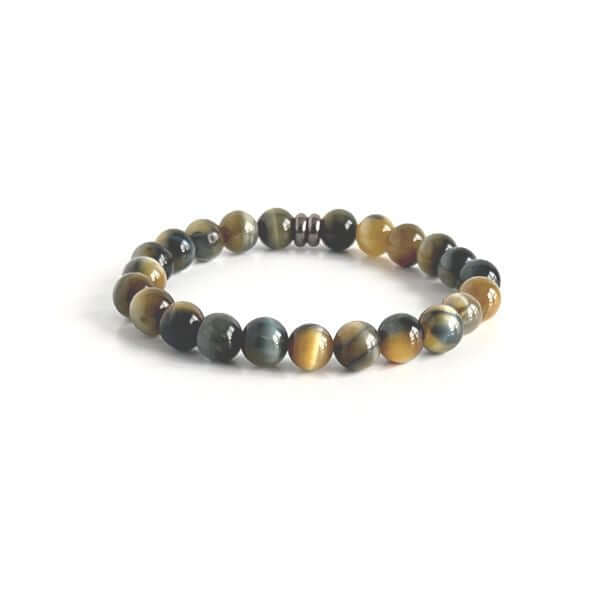 Blue and Blonde Tiger Eye Bead Bracelet This bracelet is made with high-quality Blue and Blonde Tiger Eye stones which bring confidence and optimism to the wearer. Zodiac Signs: Leo and Capricorn. Chakras: Root and Solar Plexus. Handmade with authentic cr