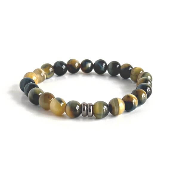 Blue and Blonde Tiger Eye Bead Bracelet This bracelet is made with high-quality Blue and Blonde Tiger Eye stones which bring confidence and optimism to the wearer. Zodiac Signs: Leo and Capricorn. Chakras: Root and Solar Plexus. Handmade with authentic cr