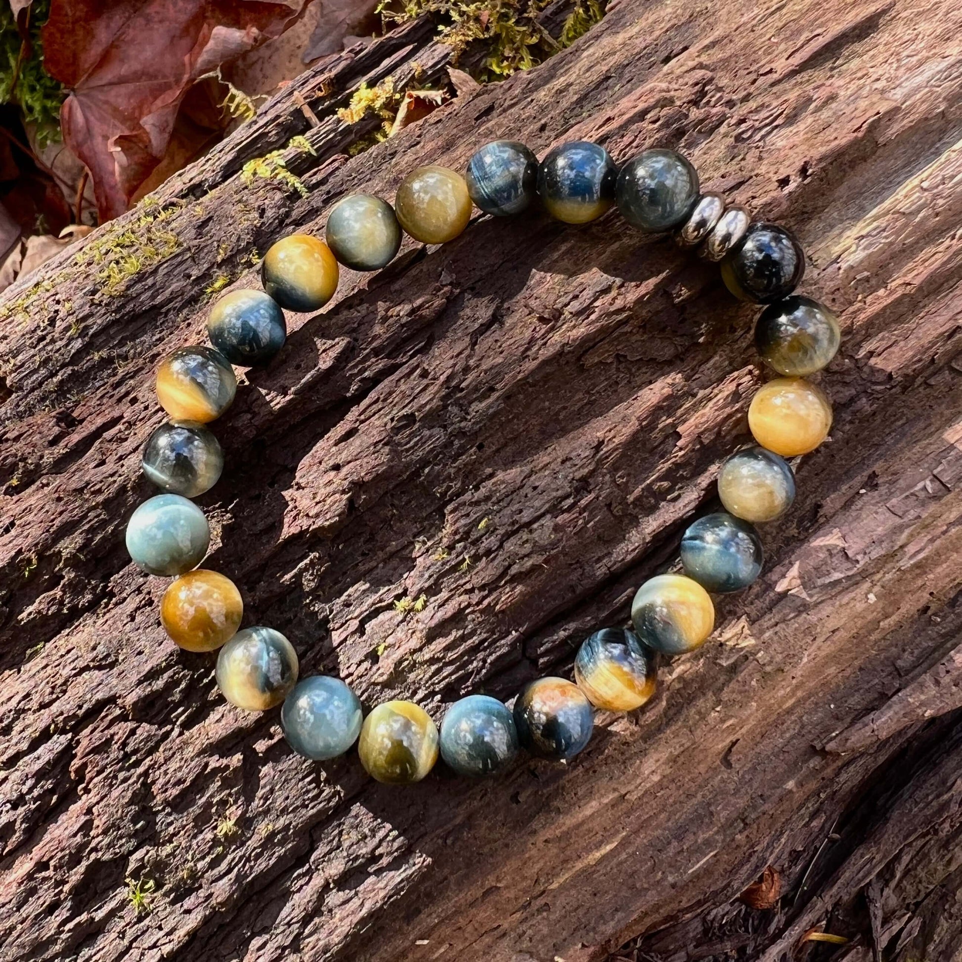 Blue and Blonde Tiger Eye Bead Bracelet This bracelet is made with high-quality Blue and Blonde Tiger Eye stones which bring confidence and optimism to the wearer. Zodiac Signs: Leo and Capricorn. Chakras: Root and Solar Plexus. Handmade with authentic cr