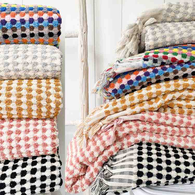 Stack of colorful Premium 100% Organic Cotton Turkish Jacquard Bath Towels in a variety of options.