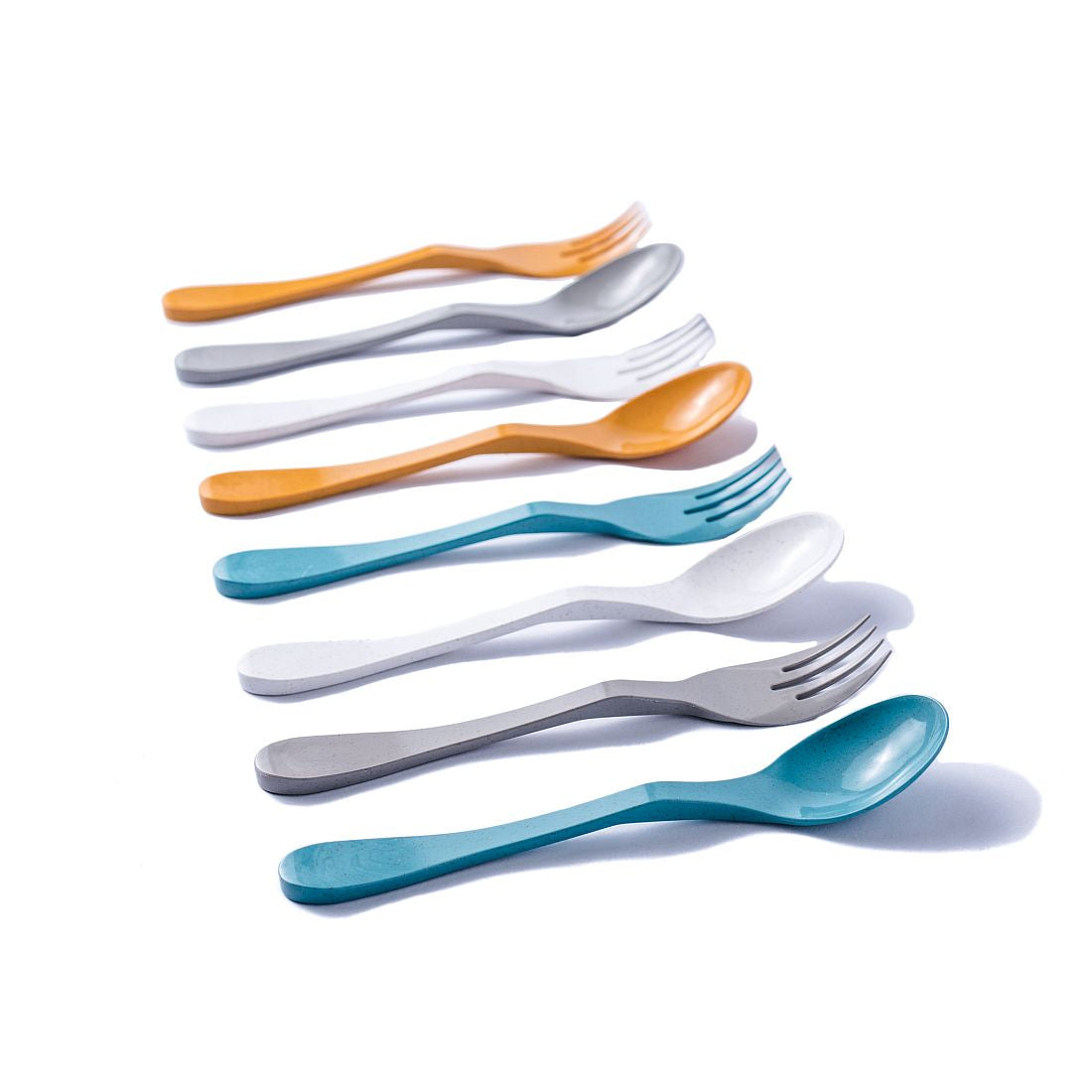 Set of 8 travel-ready, plastic-free bamboo colorful forks and spoons on a white background