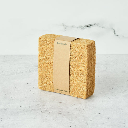 6-pack of biodegradable compost bin filters by Bamboozle, suited for the Astrik Indoor Compost Bin 1-year of odor control on a marble surface