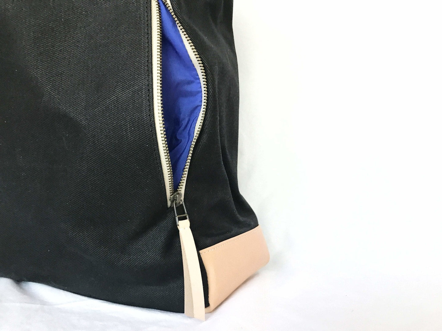 Zipper on a Black Waxed Canvas Tote Bag with Royal Blue Nylon Lining – Durable & Stylish - on a white background