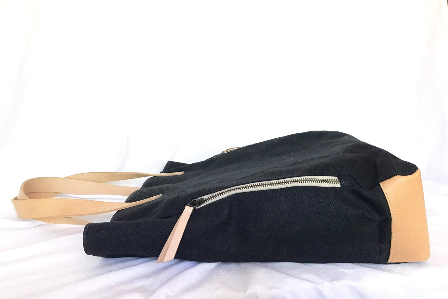 Black and beige Waxed Canvas Tote Bag with Royal Blue Nylon Lining – Durable & Stylish with a zipper on a white background