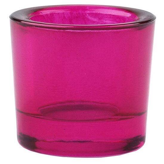 Fuchsia glass candle holder on a white background