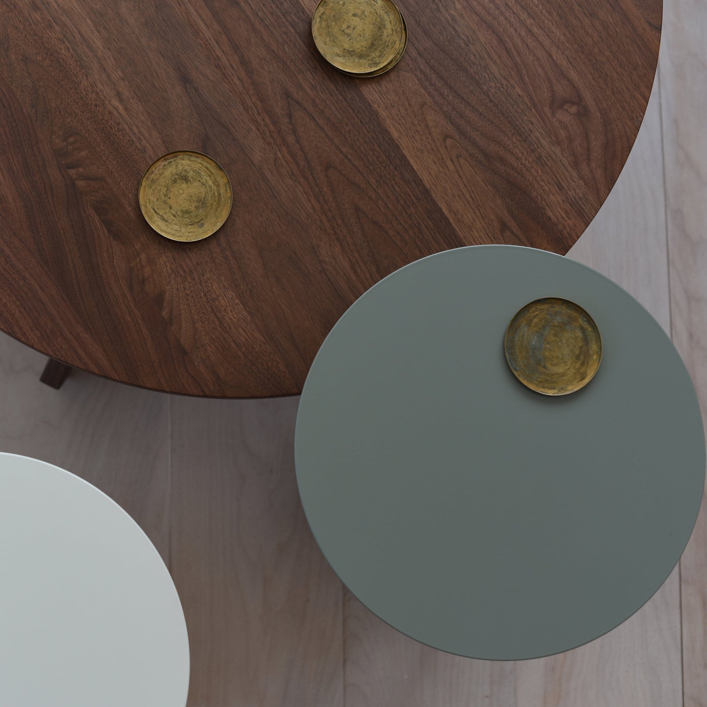 Conrad Cofee Table Solid Walnut with gold coasters on a wooden floor