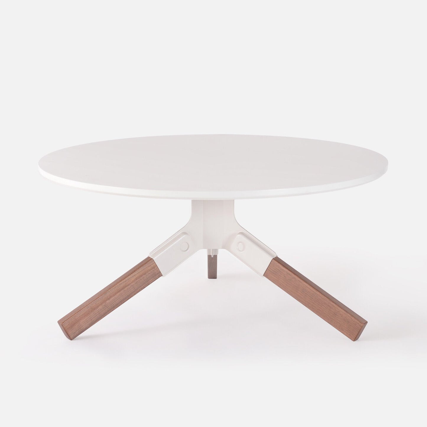 White Conrad Coffee Table with white base and wooden legs on a white background