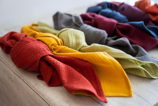 Colorful 100% crinkle cotton dinner napkins (set of 4) from Dot and Army, arranged on a wooden surface