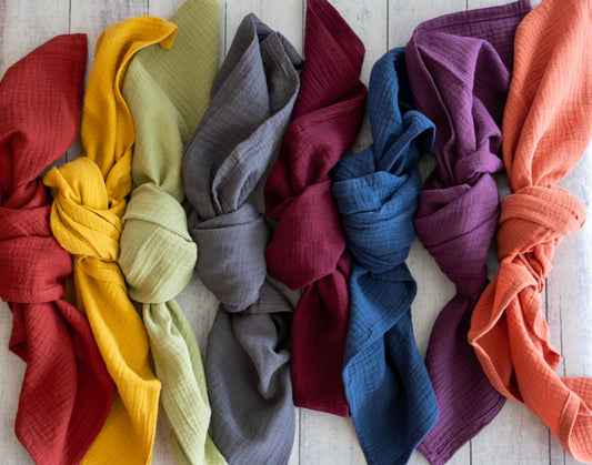 Colorful 100% crinkle cotton dinner napkins (set of 4) from Dot and Army, arranged on a wooden surface