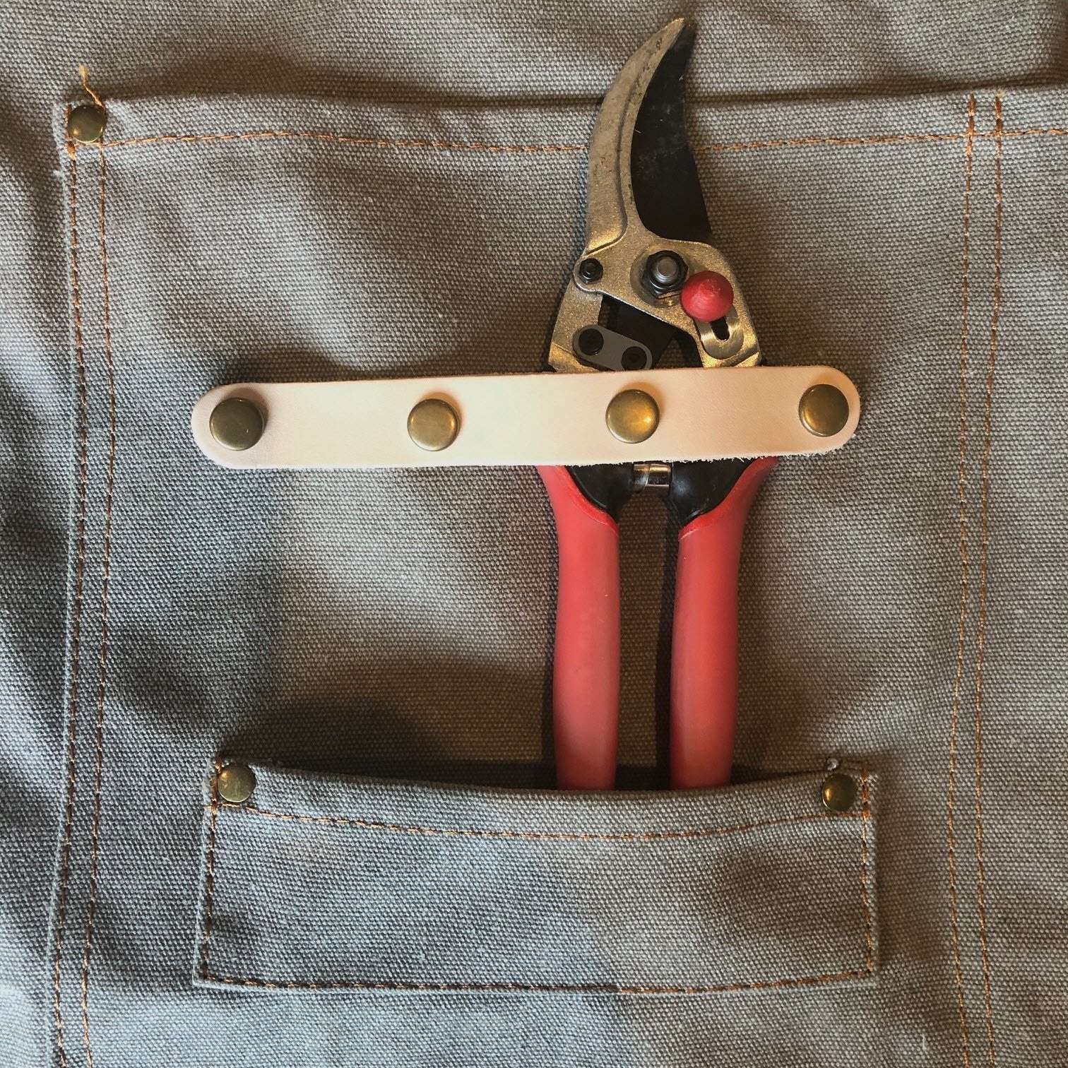 Pruning shears with leather sheath in a waxed canvass pocket