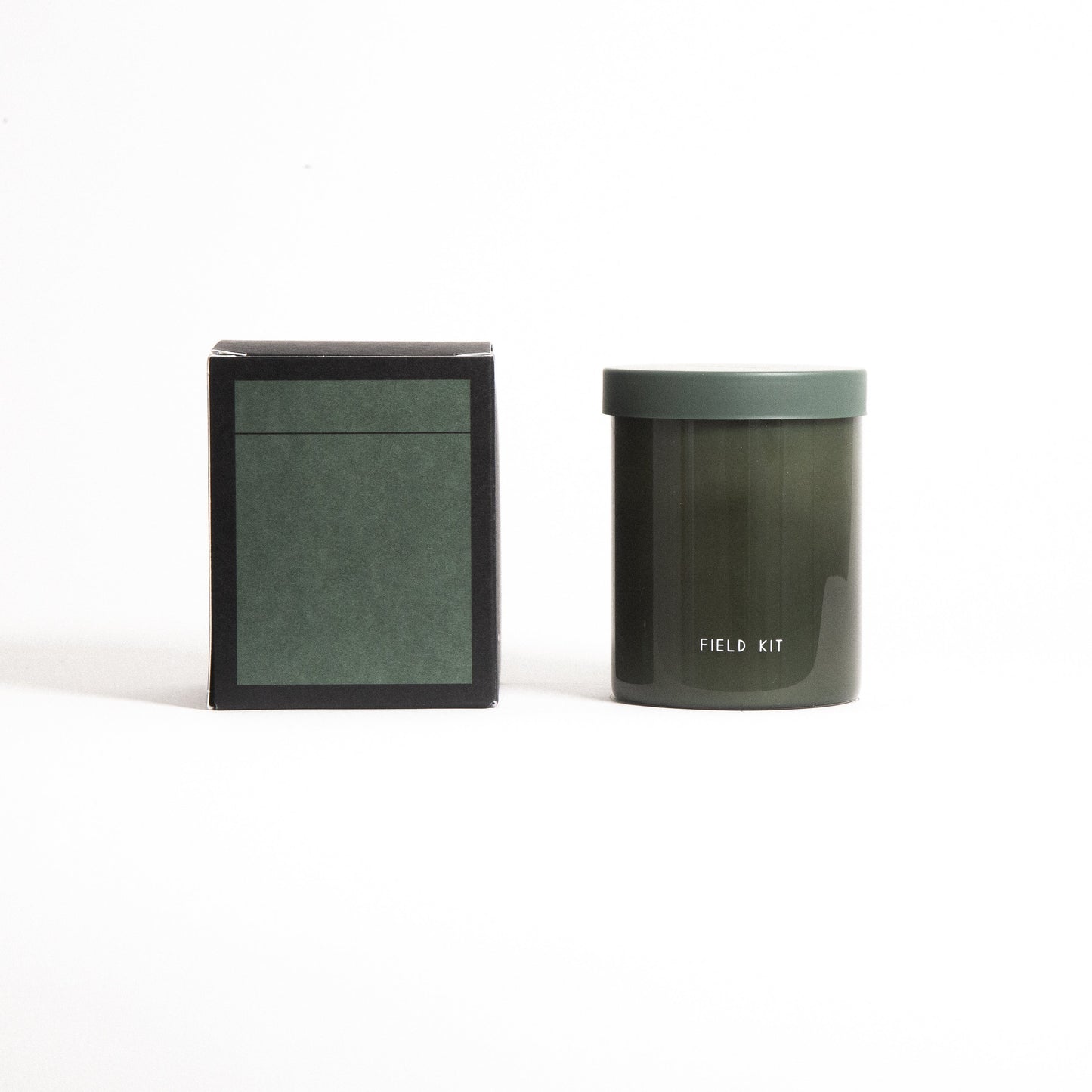 The Greenhouse Candle by Field Kit in Reusable Glass Jar and Plastic Free Packaging. Top notes: tomato leaf + coriander; Mid notes - galbanum + jasmine; Base notes - earth