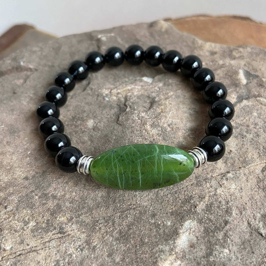 Jade Focal Bracelet. This bracelet is made with high-quality Jade and either Black Onyx or Obsidian stones which bring calm and insight to the wearer. Zodiac Signs: Capricorn, Gemini, Libra, Taurus, and Virgo. Chakra: Heart. Handmade with authentic crystals