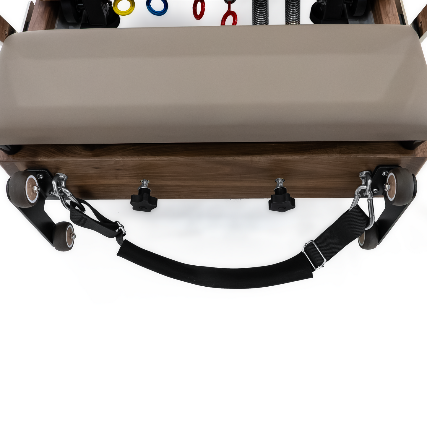 Foldable Pilates reformer stored upright for compact home spaces.