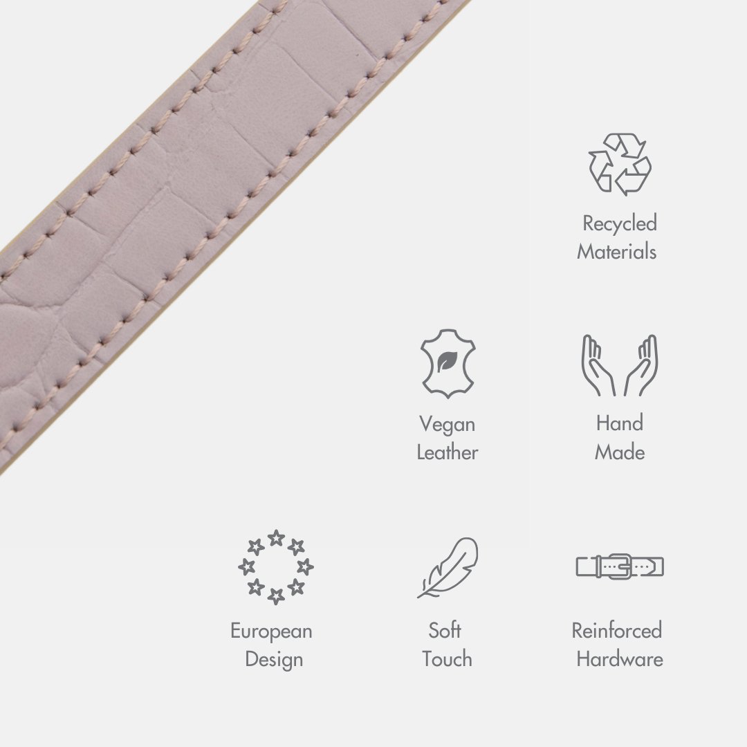 Close-up of a lilac Nina Woof dog collar made of vegan leather with sustainability icons on a white background