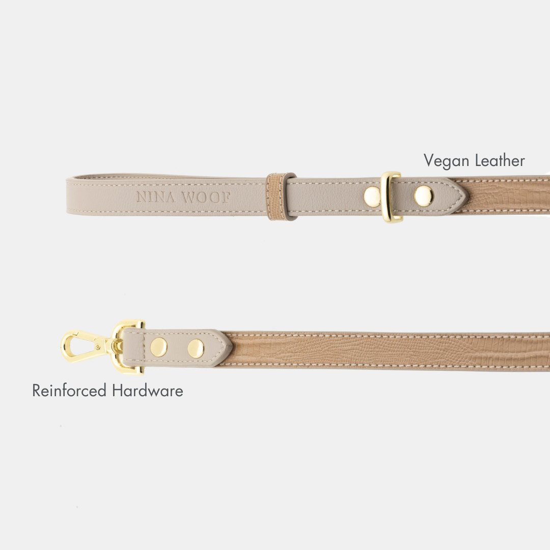 Beige Nina Woof crocodile-style vegan leather Dog Leash and reinforced gold hardware on a light gray background