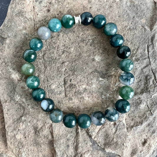 Moss Agate Bracelet. This bracelet is made with high-quality Moss Agate gemstones which bring abundance and grounding energy to the wearer. Zodiac Sign: Virgo. Chakra: Heart. Handmade with authentic crystals & gemstones in Minneapolis, MN.