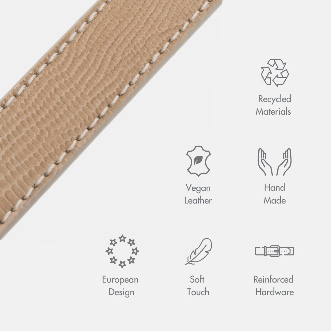 Close-up of a beige Nina Woof vegan leather dog leash with sustainability icons depicting the use of recycled materials, the product is hand made, of European design, has a soft touch and incorporates reinforced hardware on a white background