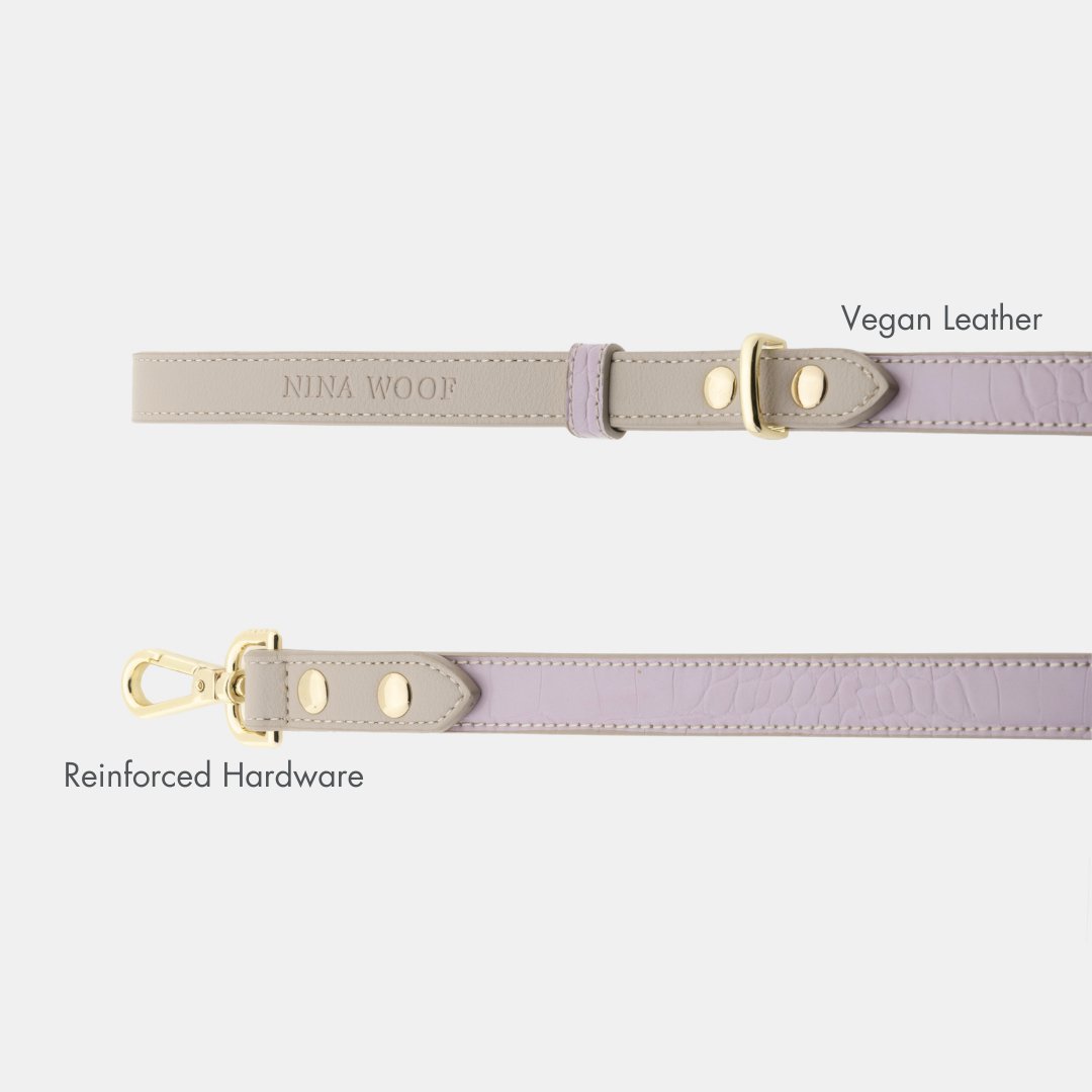 Nina Woof vegan leather dog leash handle and gold buckle hardware on a white background.