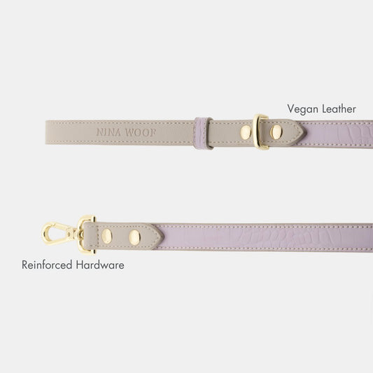 Nina Woof vegan leather dog leash handle and gold buckle hardware on a white background.