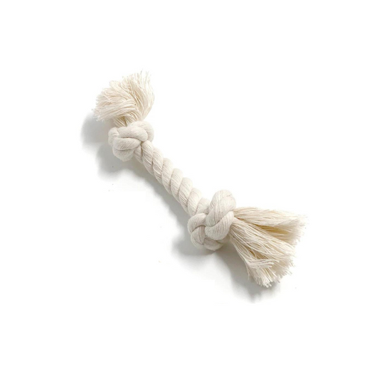 White knotted sustainable cotton dog rope toy with tassels on a white background