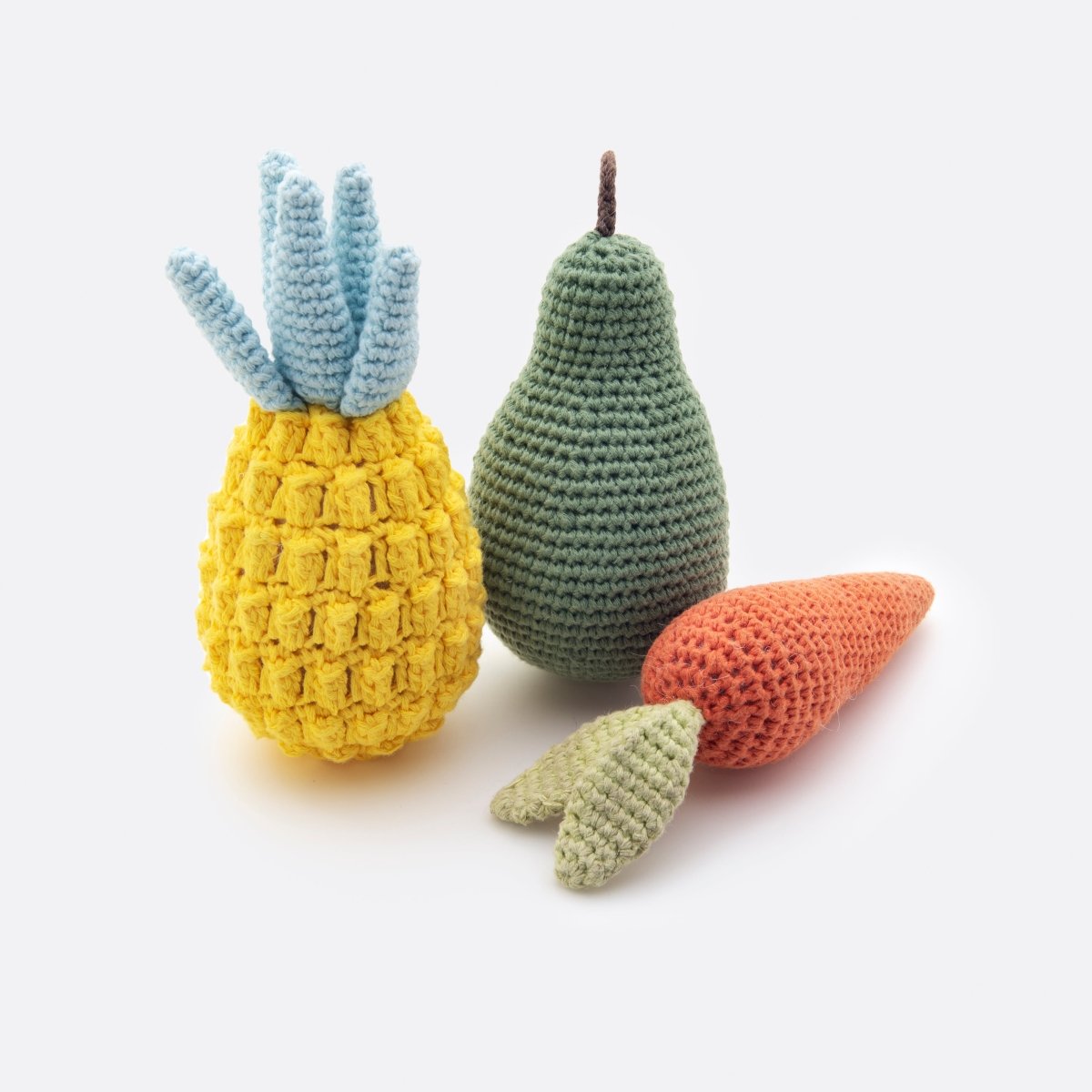 Crocheted Organic Cotton Dog Toy Bundle – Eco-Friendly Squeaky Carrot, Pear & Pineapple Set - a white background