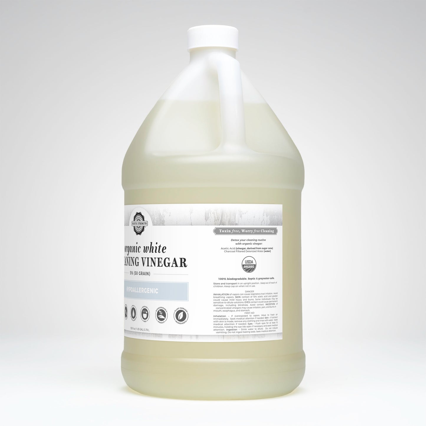 Gallon container of organic white cleaning vinegar on a white background
