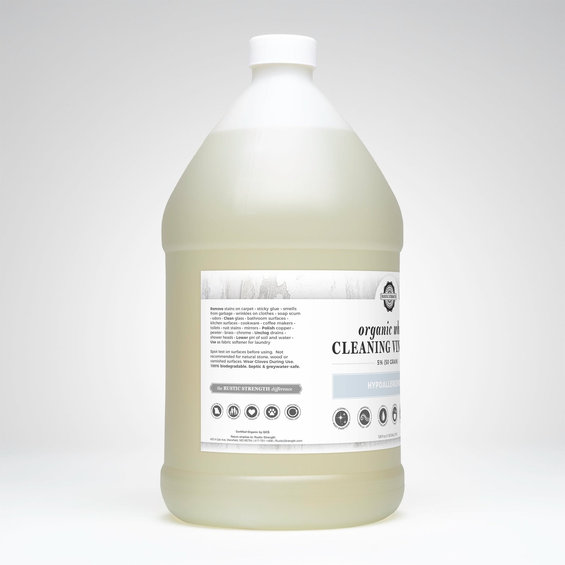 Gallon bottle of cleaning vinegar with a label on a white background