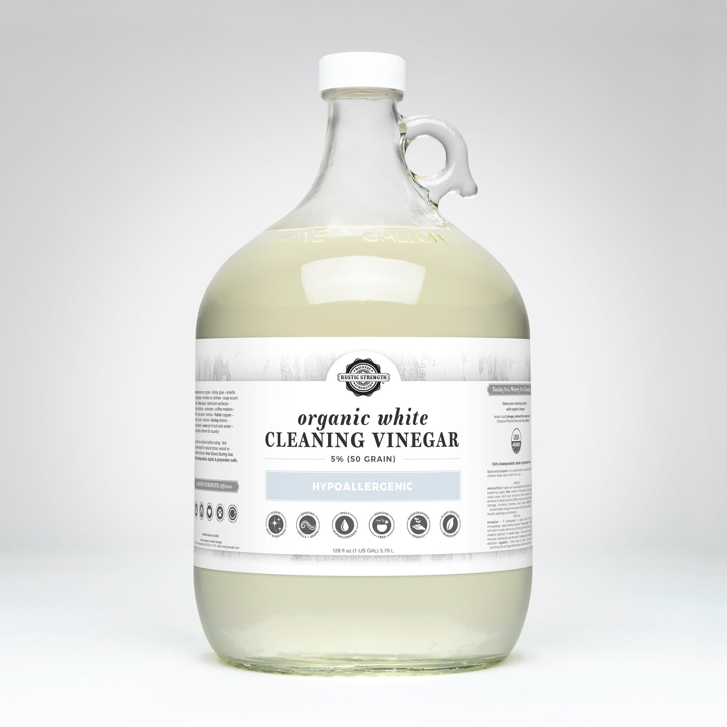 Gallon jug of organic white cleaning vinegar on a white background