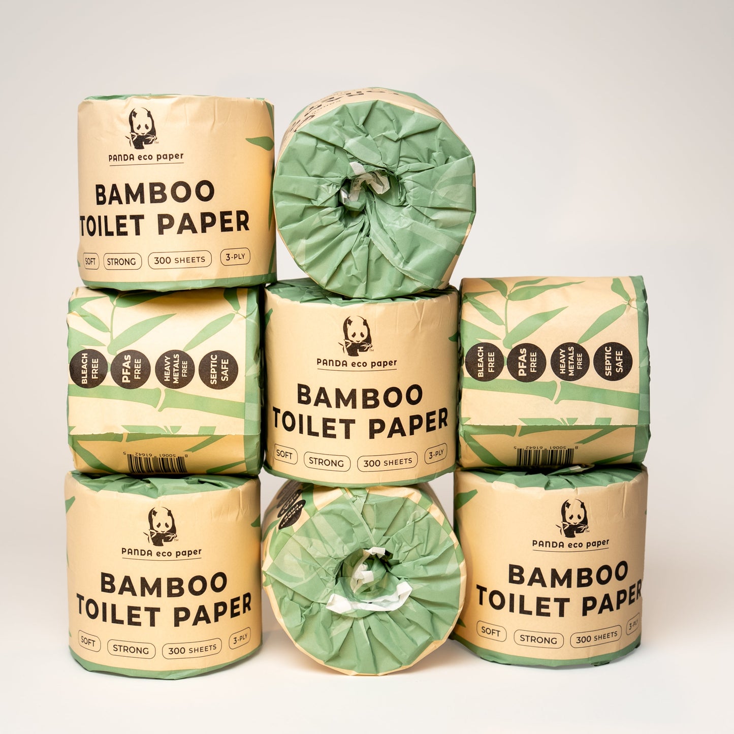 Stack of Panda Eco Paper Bamboo Toilet Paper rolls with packaging on a white background